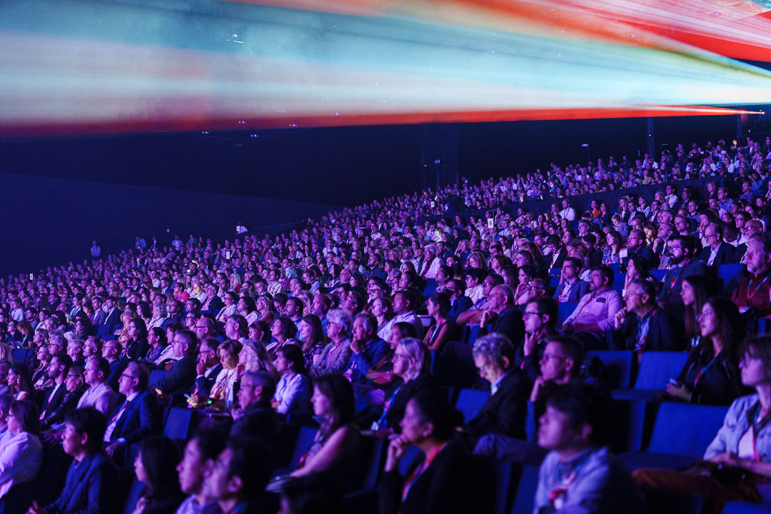 Large crowd in a hall.